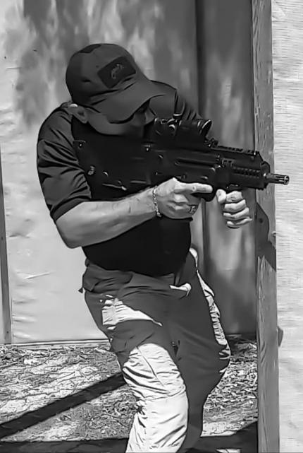 A cadet armed with an automatic machine fulfills the technique of entering a room during a course at a training ground in Israel