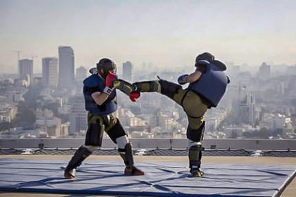 Two Israeli special forces officers practice hand-to-hand combat during a training course